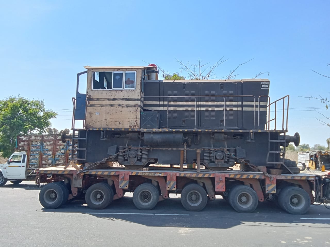 Locomotive transported on multi-axle heavy-duty trailer for ODC cargo movement