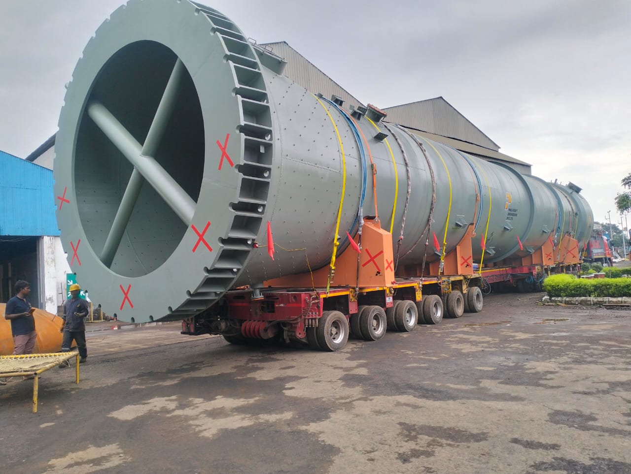 Oversized industrial equipment transported on multi-axle hydraulic trailer